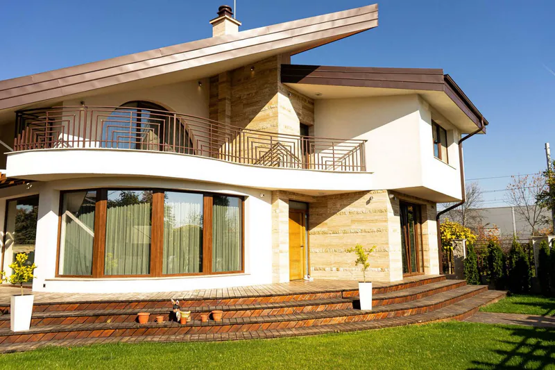 Detached house with extensive glazing and a garden