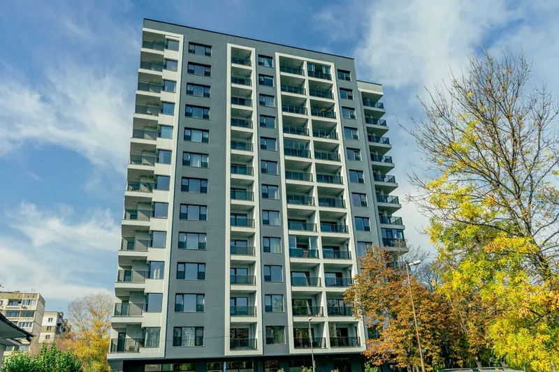 Tall residential building among trees