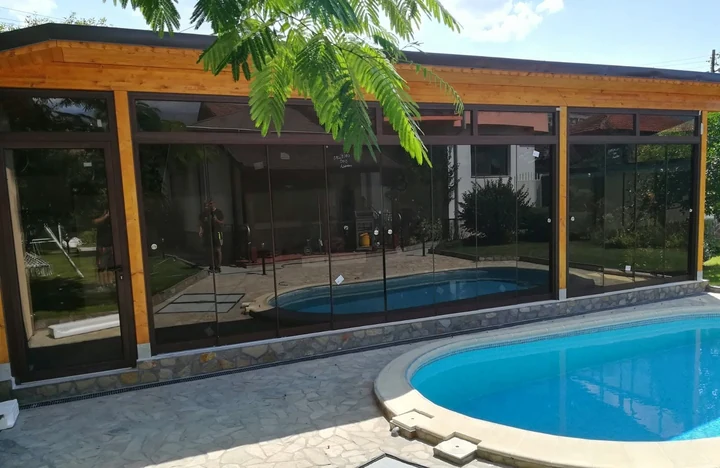 Panoramic glazing beside a pool