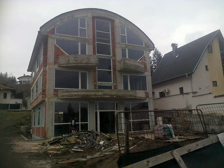 House with arched glazing — during construction
